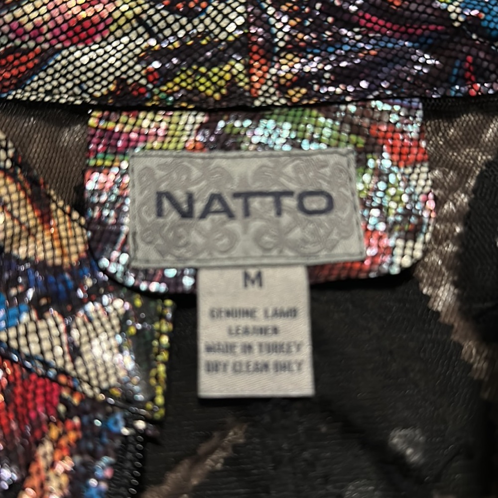 Multicolored genuine lamb skin leather jacket with embroidery on black sheer.